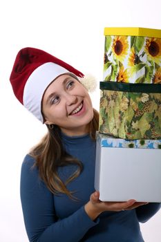 A girl in a new year cap with three boxes