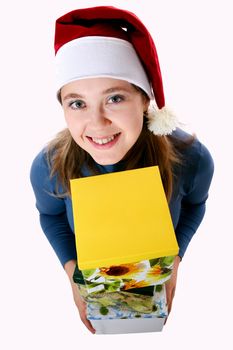 A girl in a new year cap with a yellow box