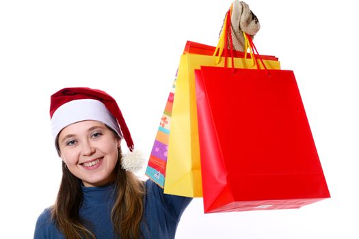 A girl in a new year cap with gift bags