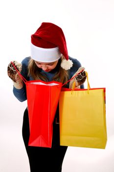 A girl in a new year cap with presents