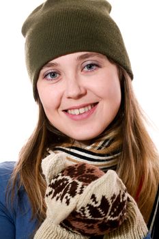 An image of a smiling girl in mittens with pattern