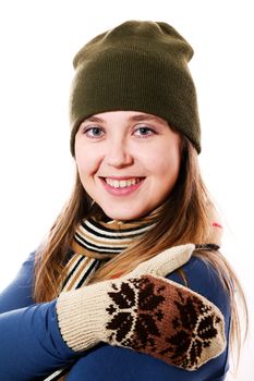An image of a smiling girl in mittens and a scarf