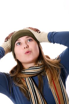 An image of a girl in a green hat looking up