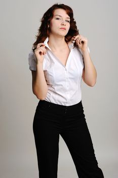 An image of young beautiful woman in white blouse