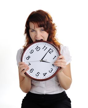 An image of a woman biting a big clock