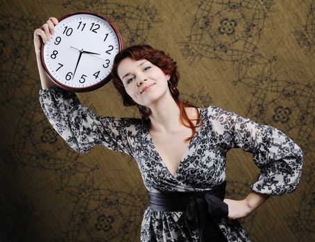 An image of a nice woman with a big clock