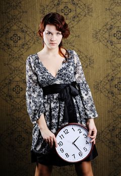 An image of a woman with a clock
