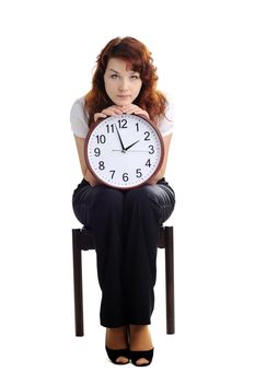 An image of a woman holding a big clock
