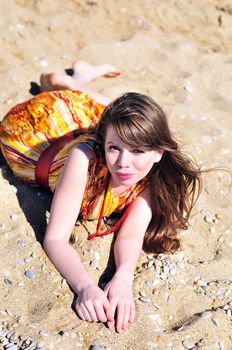  summer pretty girl laying on the sand 