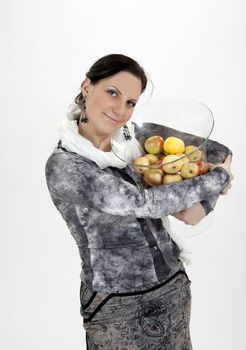 Cute girl standing with apples.