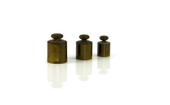 copper weights on isolated white background