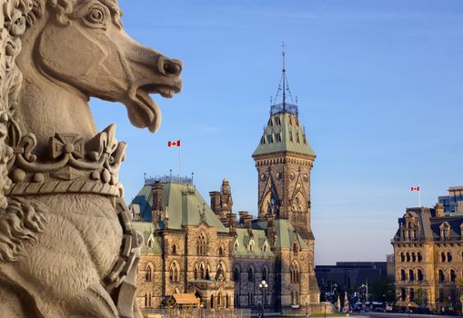 A view of the Canadian Parliament  East and Langevin blocks seen from the Centre block unicorn sculpture.
