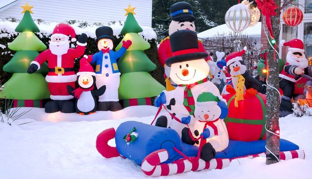 Urban Christmas scene of a home decorated with festive cartoon characters.