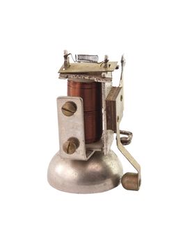 The isolated, old, small disassembled electric bell