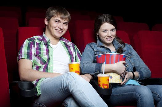 couple in a movie theater, watching a movie