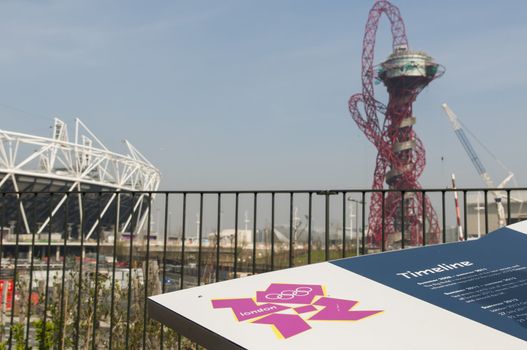 LONDON, UK – MARCH 24: Details of information board with London Olympics logo and Stadium and sculpture in the background on March 24, 2012 in London. The Olympic Park is due to be ready in summer.