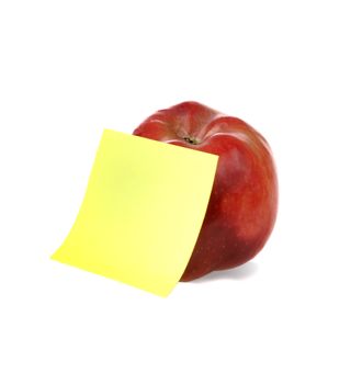 Fresh red apple with yellow notepaper for your notes
