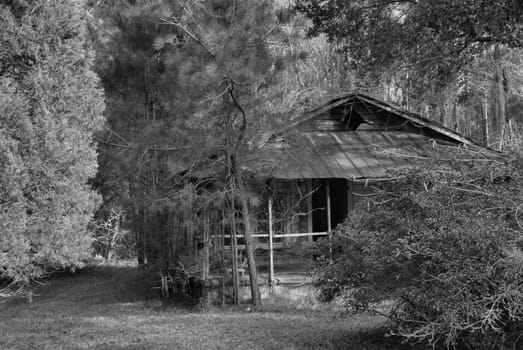 An old abandoned house shown in black and white