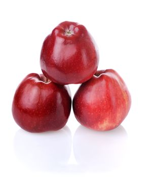 Pyramid with three fresh red apples on white background