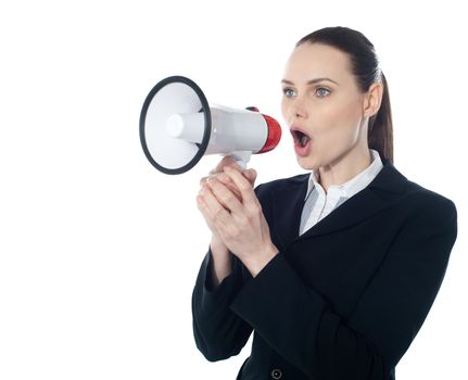 Business woman giving instructions with megaphone isolated over white