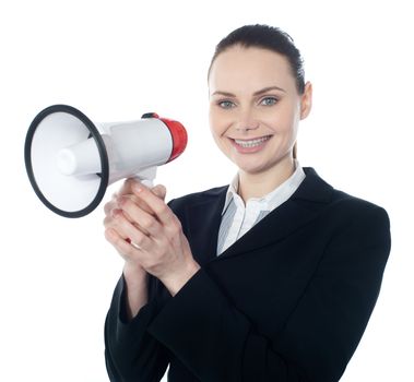 Attractive woman with megaphone isolated on white