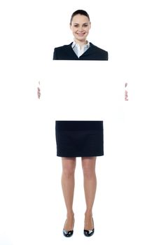 Caucasian businesswoman holding a blank billboard isolated on white background