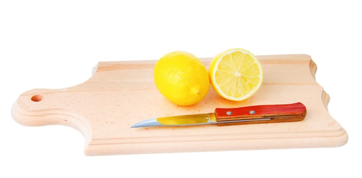 One whole lemon and one cutted lemon with knife on wooden plank. Isolated on white background.