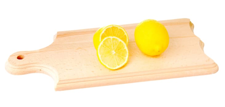 One whole lemon and one cutted lemon on wooden plank. Isolated on white background.