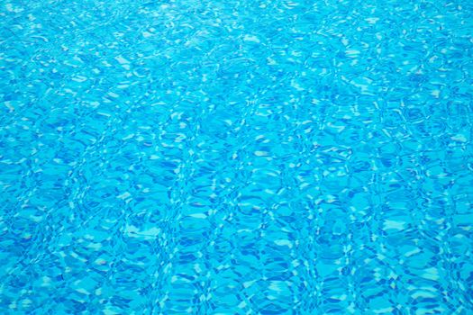 Texture of clear water in swimming pool 