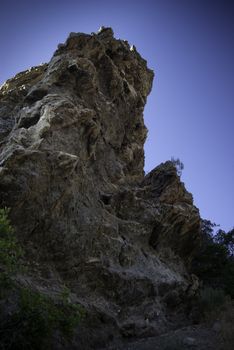 large rock cliffs in American Fork Canyon, Utah viewed from below