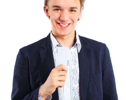 Young boy with a joker in his hand. Isolated
