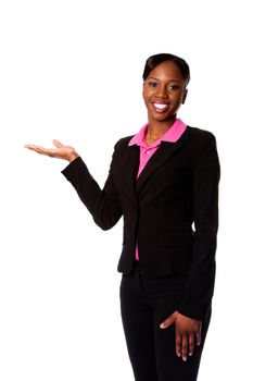 Beautiful happy smiling African corporate business student woman in suit standing presenting product with hand, isolated.