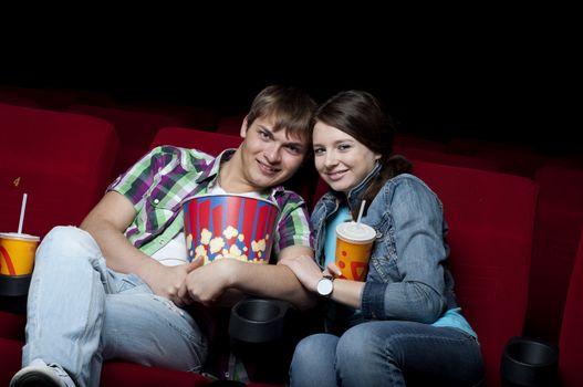 couple in a movie theater, watching a movie