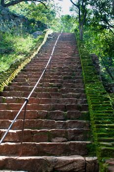 Ancient steps in rock fortress and palace on high Lion's rock , Sigiriya