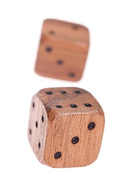 Wooden dice isolated on white background/ Selective focus on front dice edge.