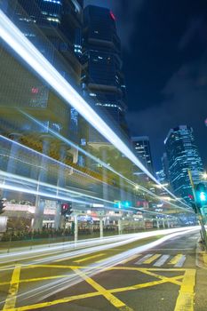 Modern city with busy traffic at night