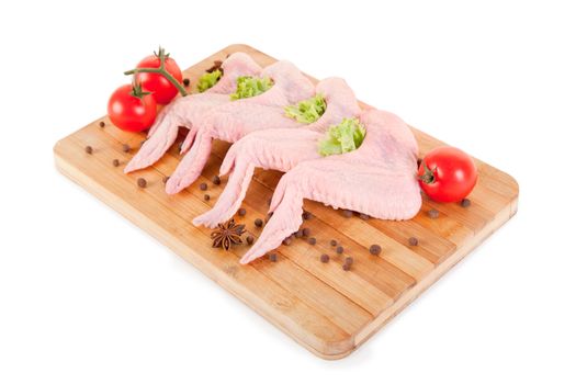 Raw chicken wings with condiments, clipping path included 