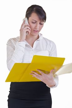 office assistant speaking over phone about document which is in front of her in folder
