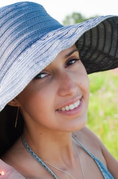 Portrait of beautiful brunette woman with long hair