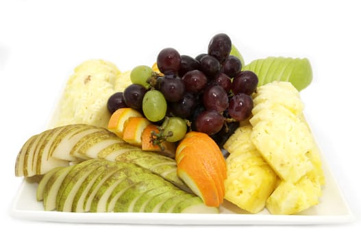 plate with exotic fruits on white background