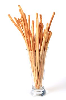 Breadsticks in glass isolated over white background