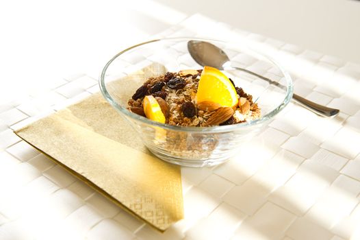 Muesli in a bowl with orange. Healthy