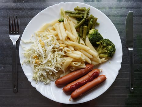 Large Portion pasta with vegetables and sausages