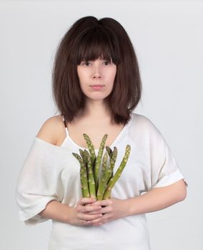 The young beautiful woman with the fresh vegetables, the concept of healthy food