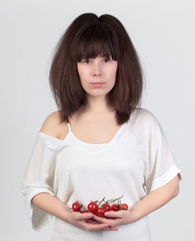 The young beautiful woman with the fresh vegetables, the concept of healthy food