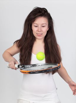 Young woman with tennis racket isolated on white