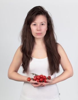 The young beautiful woman with the fresh vegetables, the concept of healthy food