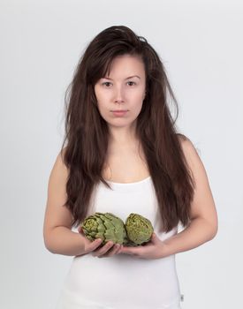 The young beautiful woman with the fresh vegetables, the concept of healthy food