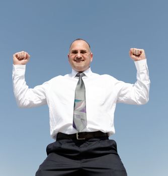 happy businessman is jumping outdoors