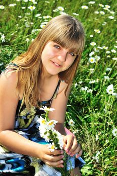 teen girl making a wreath on the daisy meadow